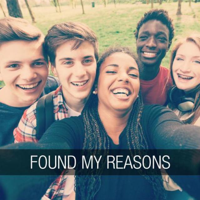 Group of fine teens crowd in to take a selfie. The text "found my reasons" runs along the bottom of the image in a banner.